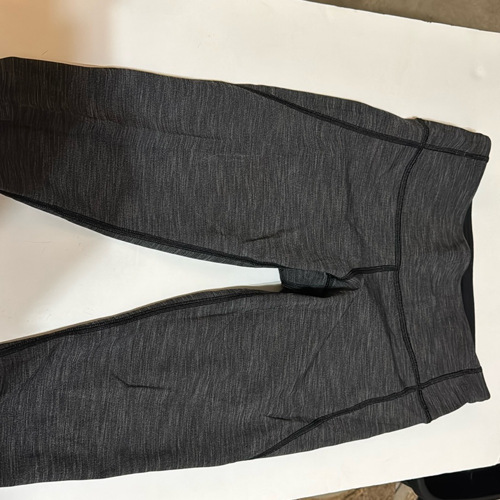 Lulu lemon grey leggings slightly above ankle length. Sit at hip length.